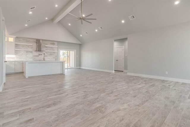 580 Highview Ct, Godley, TX 76044 - unfurnished living room featuring beam ceiling, ceiling fan, light wood-style floors, baseboards, and high vaulted ceiling