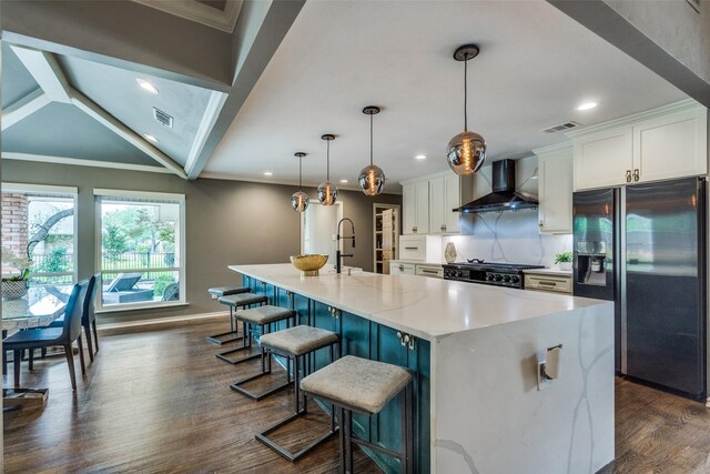 2021 Wing Point Ln, Plano, TX 75093 - kitchen with wall chimney exhaust hood, refrigerator with ice dispenser, range, white cabinetry, and baseboards