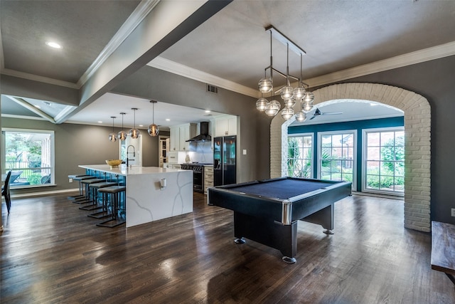 2021 Wing Point Ln, Plano, TX 75093 - playroom with dark wood finished floors, pool table, crown molding, baseboards, and a sink
