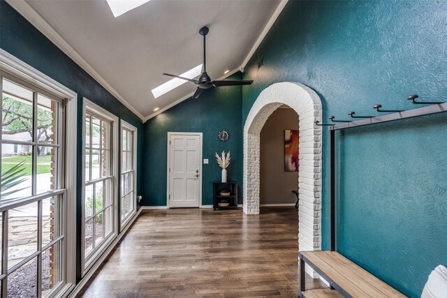 2021 Wing Point Ln, Plano, TX 75093 - foyer with a skylight, lofted ceiling, crown molding, a wood stove, and wood finished floors