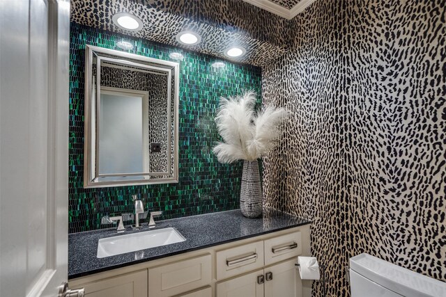 2021 Wing Point Ln, Plano, TX 75093 - half bathroom with toilet, vanity, and tile walls
