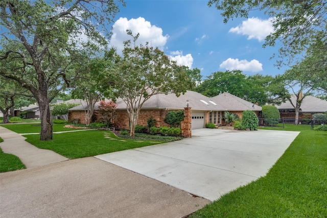 2021 Wing Point Ln, Plano, TX 75093 - single story home featuring an attached garage, concrete driveway, and brick siding