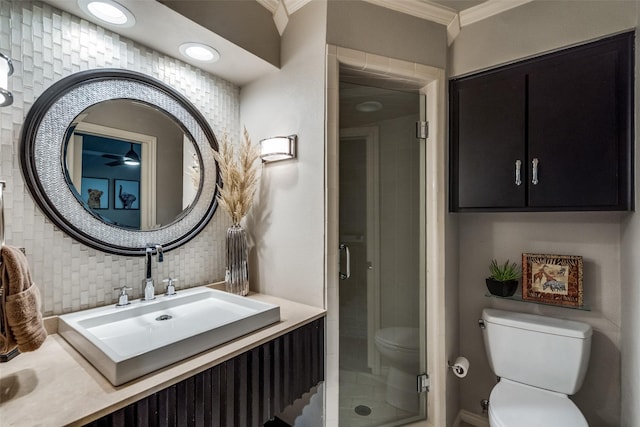 2021 Wing Point Ln, Plano, TX 75093 - bathroom with toilet, ornamental molding, vanity, a shower stall, and tasteful backsplash