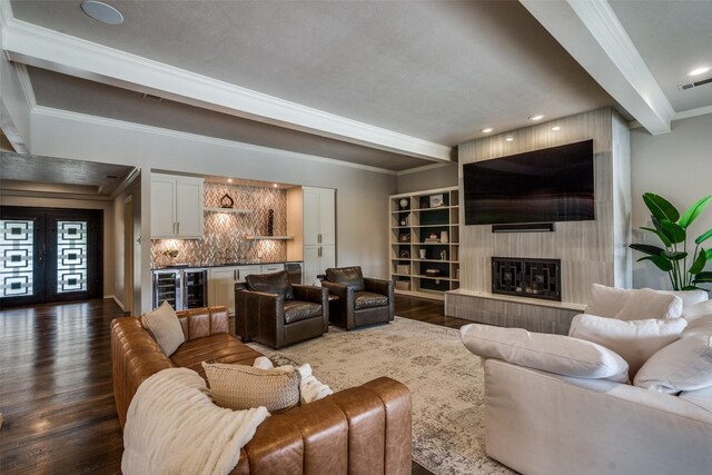 2021 Wing Point Ln, Plano, TX 75093 - living room with bar, ornamental molding, dark wood-style flooring, beamed ceiling, and a fireplace