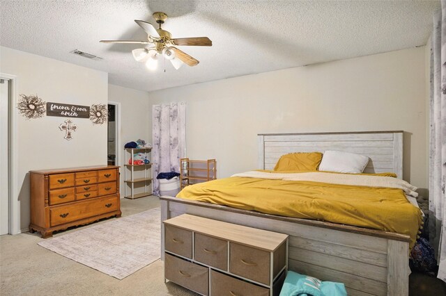 111 Christopher Dr, Cooper, TX 75432 - carpeted bedroom with a textured ceiling and ceiling fan