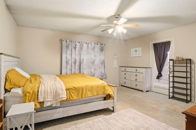 111 Christopher Dr, Cooper, TX 75432 - bedroom featuring carpet, a textured ceiling, and a ceiling fan