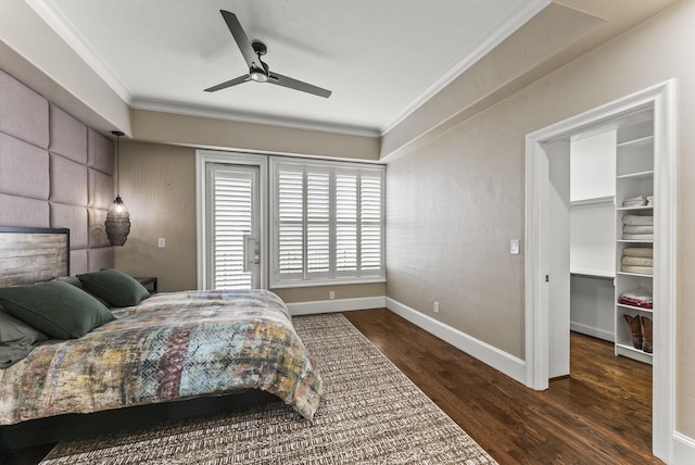 5055 Addison Cir Unit 723, Addison, TX 75001 - bedroom with crown molding, wood finished floors, baseboards, a spacious closet, and a ceiling fan