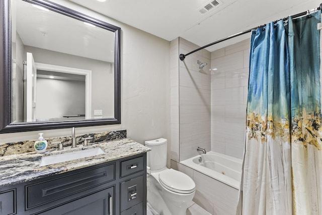 5055 Addison Cir Unit 723, Addison, TX 75001 - bathroom featuring shower / tub combo with curtain, vanity, and toilet