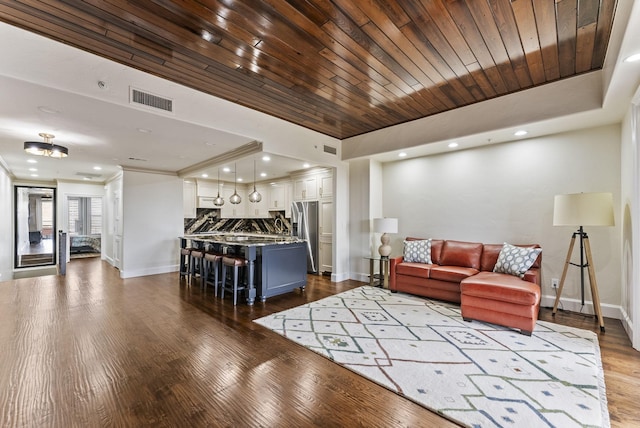 5055 Addison Cir Unit 723, Addison, TX 75001 - living area with baseboards, dark wood-style flooring, recessed lighting, and crown molding