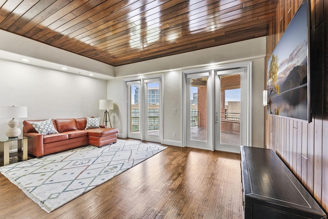 5055 Addison Cir Unit 723, Addison, TX 75001 - living area featuring wood finished floors, wooden ceiling, and baseboards