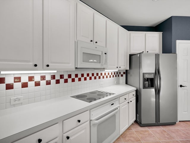 2832 Lincolnshire Dr, Richardson, TX 75082 - kitchen featuring white appliances, light countertops, white cabinets, and backsplash