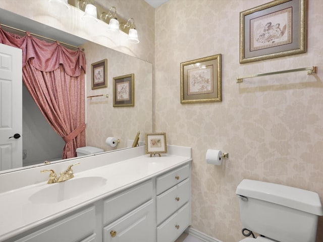 2832 Lincolnshire Dr, Richardson, TX 75082 - bathroom featuring toilet, vanity, and wallpapered walls
