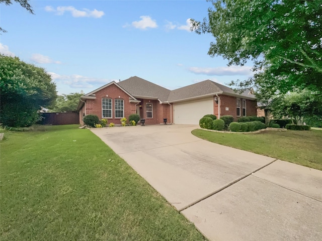 1424 Charleston Dr, Allen, TX 75002 - view of front of house featuring brick siding, a garage, concrete driveway, and a front lawn