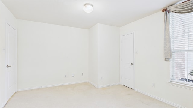 1424 Charleston Dr, Allen, TX 75002 - spare room featuring light colored carpet, baseboards, and plenty of natural light