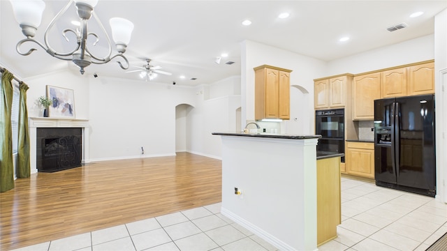 1424 Charleston Dr, Allen, TX 75002 - kitchen with black appliances, arched walkways, dark countertops, light tile patterned flooring, and a ceiling fan