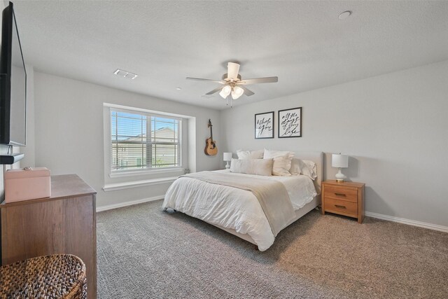 2409 Davenport Dr, Denton, TX 76207 - carpeted bedroom with baseboards and a ceiling fan