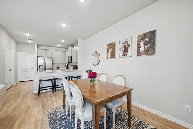 2409 Davenport Dr, Denton, TX 76207 - dining area with light wood-style floors, baseboards, and recessed lighting