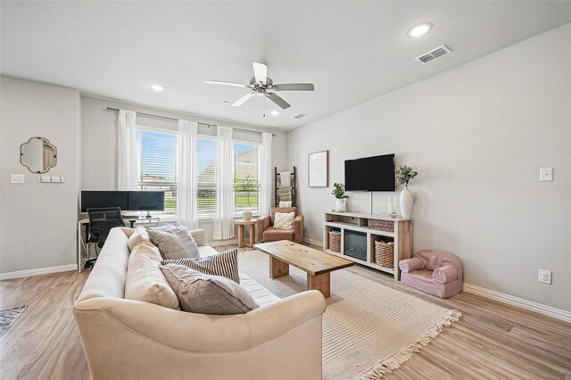 2409 Davenport Dr, Denton, TX 76207 - living room with light wood-type flooring, baseboards, a ceiling fan, and recessed lighting