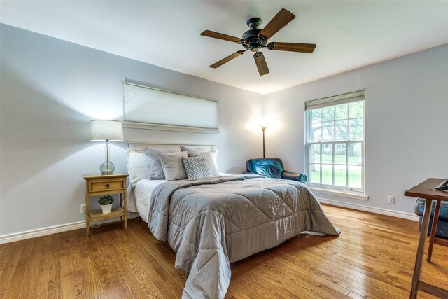 13841 Far Hills Ln, Dallas, TX 75240 - bedroom featuring light wood-type flooring and a ceiling fan