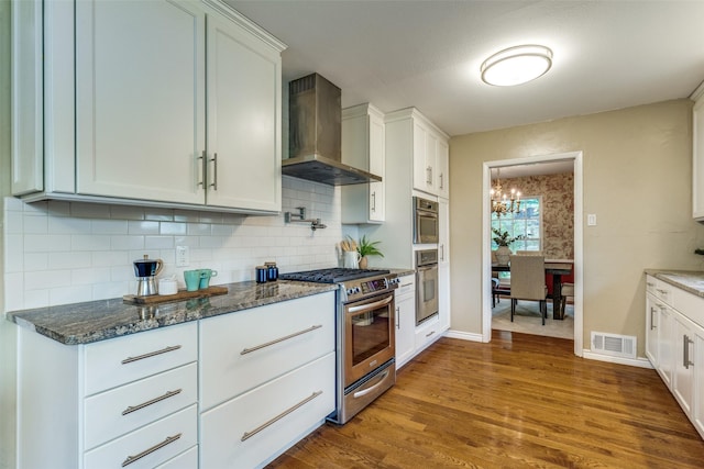 13841 Far Hills Ln, Dallas, TX 75240 - kitchen featuring gas range, wall chimney exhaust hood, dark wood-style floors, and decorative backsplash