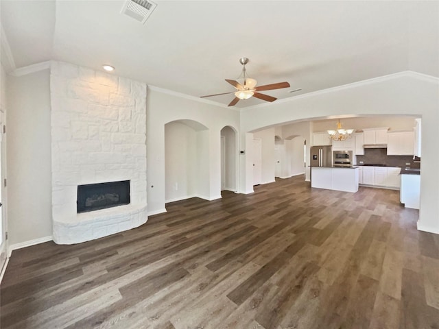 2140 Heather Glen Dr, Rockwall, TX 75087 - unfurnished living room with a fireplace, ornamental molding, ceiling fan, wood finished floors, and a chandelier