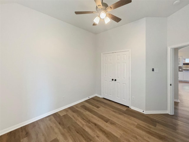2140 Heather Glen Dr, Rockwall, TX 75087 - unfurnished bedroom with wood finished floors, baseboards, a closet, and ceiling fan