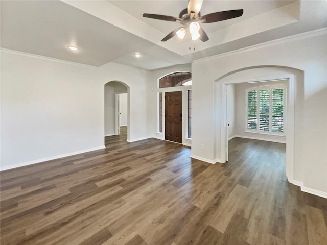 2140 Heather Glen Dr, Rockwall, TX 75087 - unfurnished room featuring arched walkways, a tray ceiling, wood finished floors, baseboards, and recessed lighting