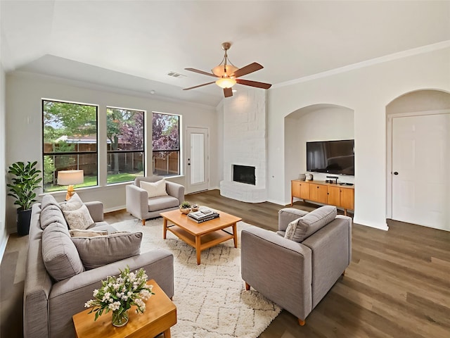 2140 Heather Glen Dr, Rockwall, TX 75087 - living area with wood finished floors, a ceiling fan, crown molding, and a fireplace
