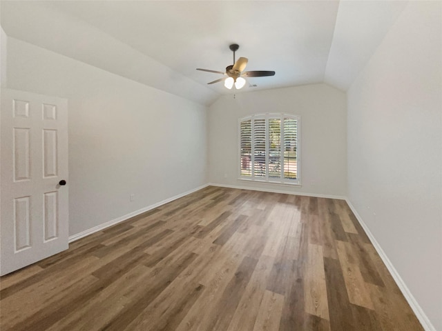 2140 Heather Glen Dr, Rockwall, TX 75087 - empty room featuring a ceiling fan, wood finished floors, lofted ceiling, and baseboards