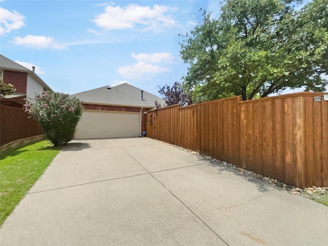 2140 Heather Glen Dr, Rockwall, TX 75087 - view of home's exterior featuring concrete driveway and a garage