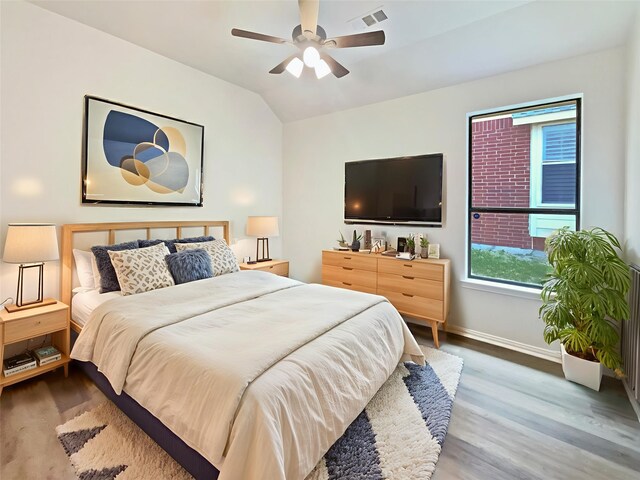 2140 Heather Glen Dr, Rockwall, TX 75087 - bedroom featuring wood finished floors, vaulted ceiling, baseboards, and a ceiling fan