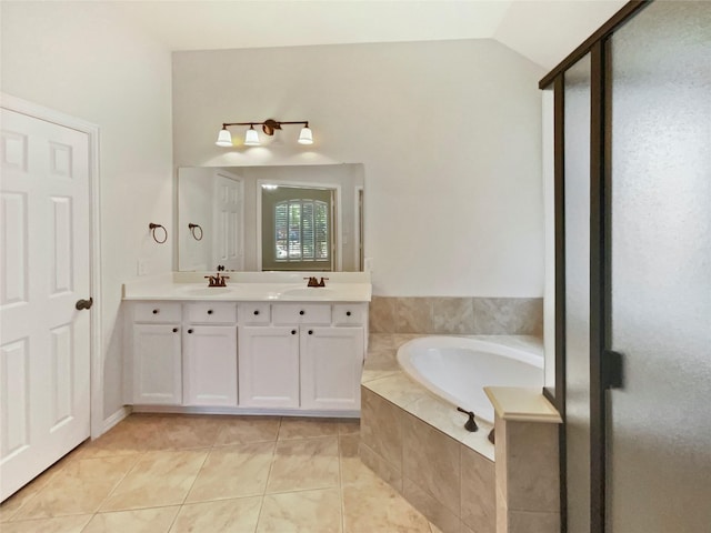 2140 Heather Glen Dr, Rockwall, TX 75087 - bathroom featuring a bath, double vanity, tile patterned flooring, a stall shower, and vaulted ceiling