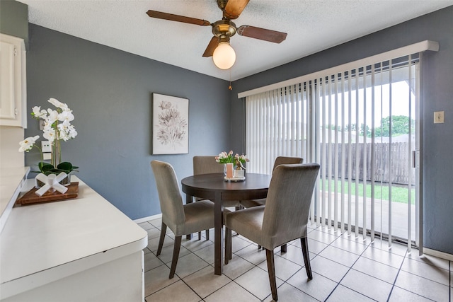 12332 Ferris Creek Ln, Dallas, TX 75243 - dining space with light tile patterned floors, a ceiling fan, and baseboards