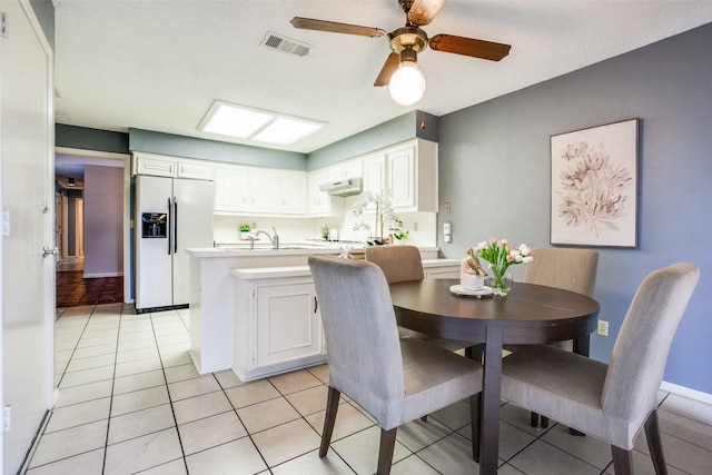 12332 Ferris Creek Ln, Dallas, TX 75243 - dining space featuring a ceiling fan, light tile patterned floors, and baseboards