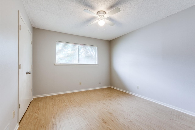 12332 Ferris Creek Ln, Dallas, TX 75243 - empty room with light wood finished floors, a textured ceiling, ceiling fan, and baseboards