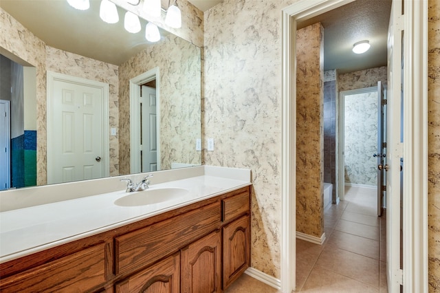 3500 Corkwood Dr, Frisco, TX 75033 - full bath with tile patterned floors, vanity, baseboards, and wallpapered walls