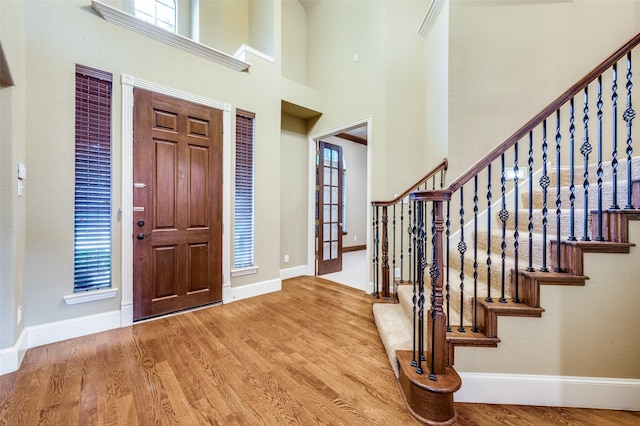 3500 Corkwood Dr, Frisco, TX 75033 - foyer entrance with wood finished floors, baseboards, stairway, and a towering ceiling
