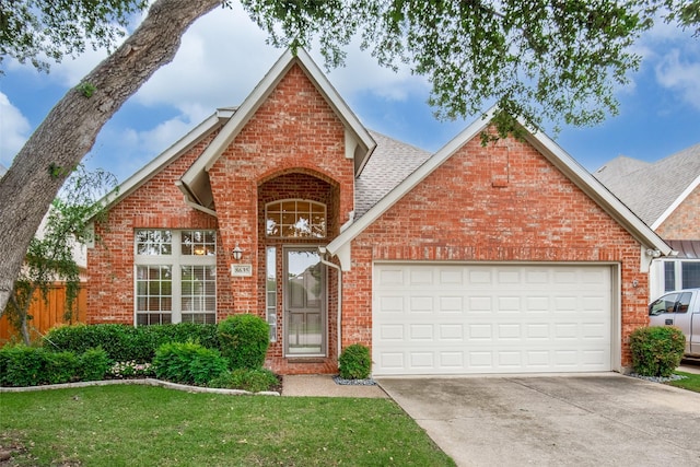 8635 Forest Glen Dr, Irving, TX 75063 - traditional home featuring brick siding, driveway, a garage, and a shingled roof
