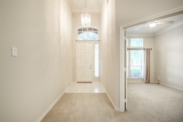 8635 Forest Glen Dr, Irving, TX 75063 - foyer with light colored carpet, crown molding, baseboards, a chandelier, and ceiling fan