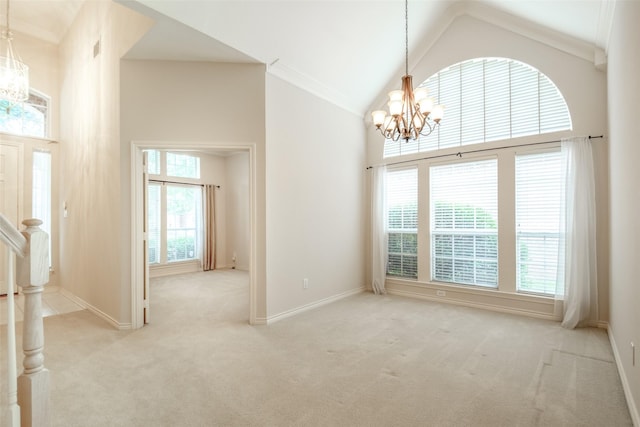 8635 Forest Glen Dr, Irving, TX 75063 - entrance foyer with a chandelier, light colored carpet, high vaulted ceiling, baseboards, and crown molding