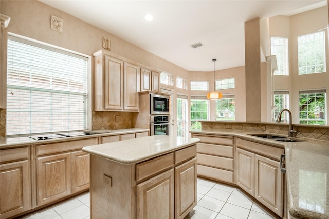 8635 Forest Glen Dr, Irving, TX 75063 - kitchen with light brown cabinetry, stainless steel appliances, a sink, light tile patterned floors, and decorative backsplash