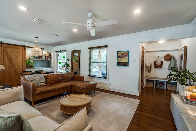 9923 Harwell Dr, Dallas, TX 75220 - living area with a barn door, dark wood-type flooring, ceiling fan, ornamental molding, and baseboards