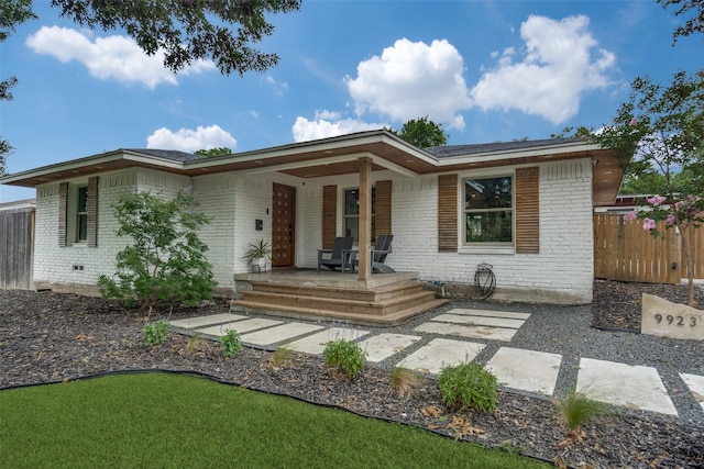 9923 Harwell Dr, Dallas, TX 75220 - view of front of house featuring brick siding and covered porch