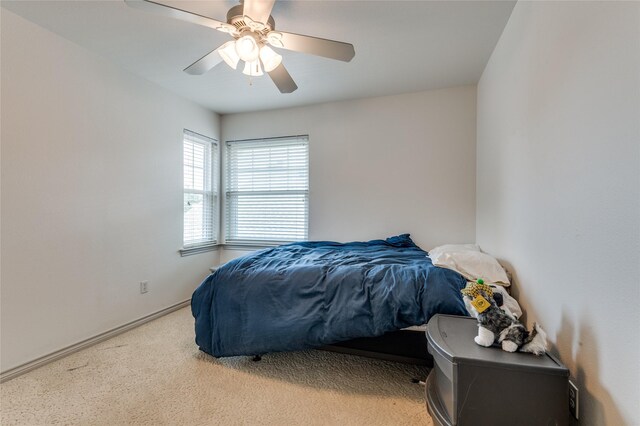 924 Mccoy Dr, Irving, TX 75062 - bedroom with carpet, a ceiling fan, and baseboards