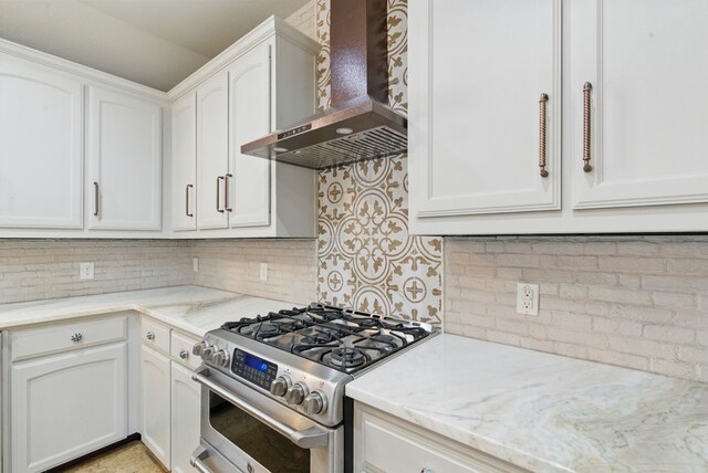 109 Pedernales Dr, New Fairview, TX 76078 - kitchen with stainless steel gas range, wall chimney range hood, backsplash, and white cabinetry