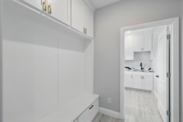732 County Road 3424, Bridgeport, TX 76426 - mudroom with a sink and baseboards