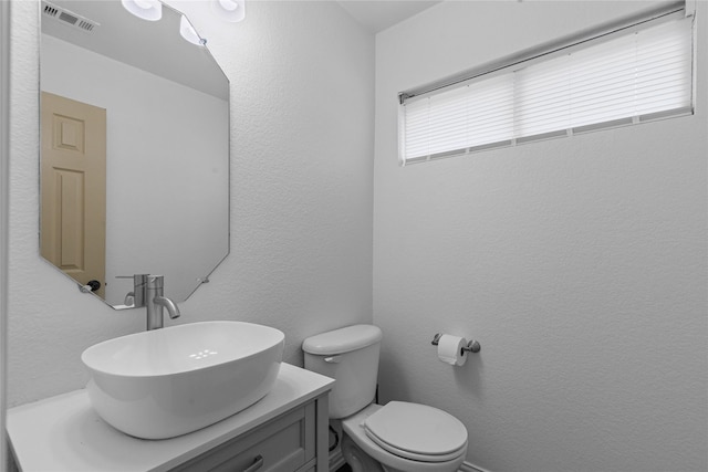 2959 Bandera, Grand Prairie, TX 75054 - half bathroom featuring vanity and toilet