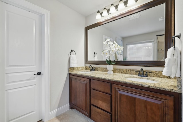 4324 Ashburn Way, Fort Worth, TX 76244 - bathroom featuring double vanity, tile patterned flooring, and baseboards