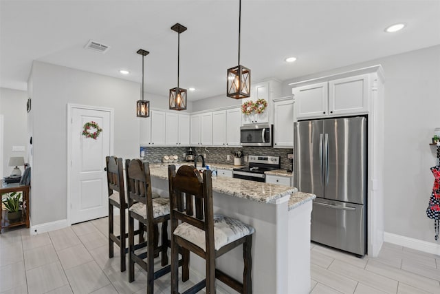 3228 Lakeside Dr, Granbury, TX 76048 - kitchen featuring stainless steel appliances, decorative backsplash, baseboards, white cabinetry, and recessed lighting