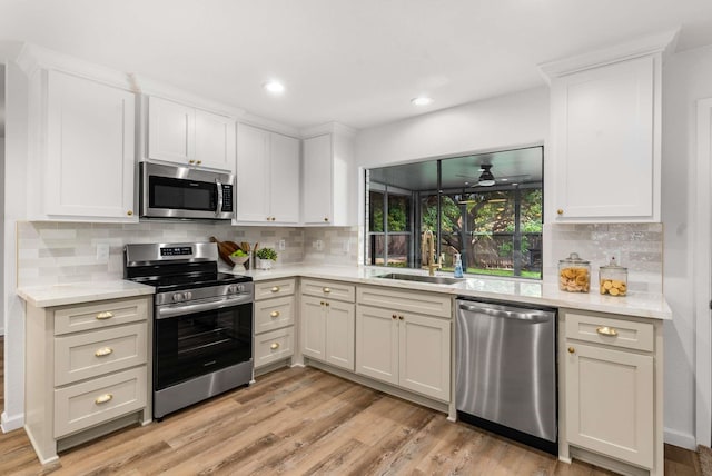 4028 Buckwheat St, Fort Worth, TX 76137 - kitchen with stainless steel appliances, a sink, light countertops, backsplash, and recessed lighting